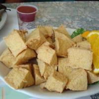 Golden Fried Tofu · Deep fried tofu served with our house sauce.