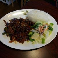 Pork Teriyaki · Juicy Pork Teriyaki served with steamed rice, salad. and sauce.