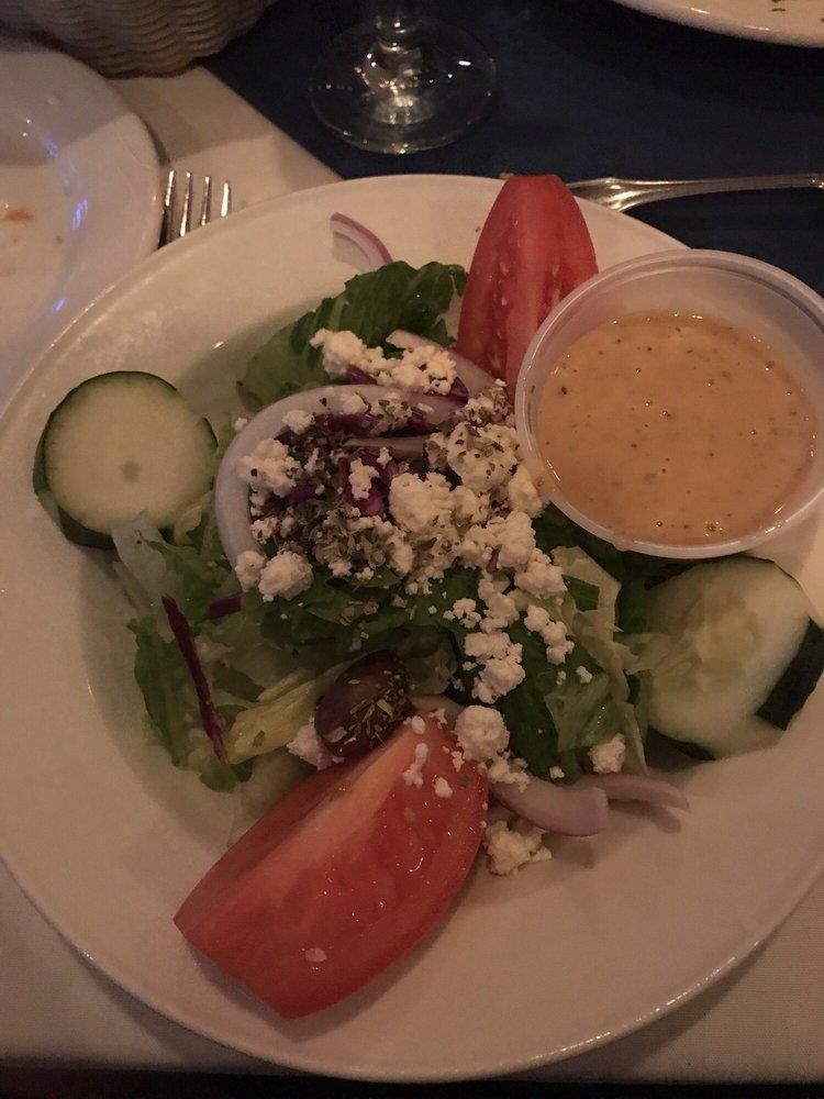 Greek Salad · Lettuce, tomatoes, cucumbers, onions, bell peppers, feta cheese, anchovies and Kalamata olives house dressing.