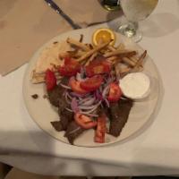 Gyro Platter · A tasty mixture of sliced ground beef and lamb. Topped with onions, tomatoes and tzatziki. a...