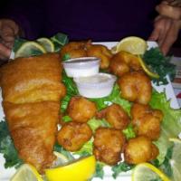Baked Seafood Platter · 2 large baked stuffed shrimp, succulent sea scallops and fresh tender scrod under lemon butt...