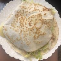 Super Quesadilla · Meat, melted cheese, guacamole, sour cream, lettuce, and salsa.