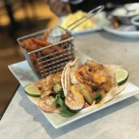 Sailor Shrimp Tacos · Grilled shrimp and pineapple, lettuce, pico de gallo and topped with spicy sauce. Made to or...