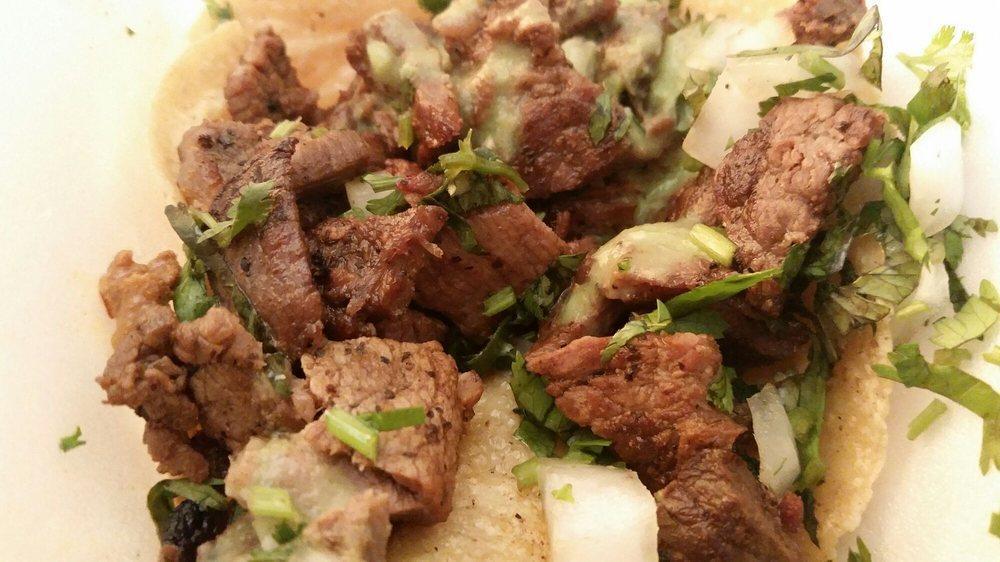 Carne Asada Taco · Grilled steak.