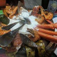 Molcajete Mixto · Grilled shrimp, breaded shrimp, octopus, fish filet, steak, chicken, chorizo, crema poblana ...