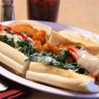Zippy Chicken Sandwich · Homemade chicken cutlet, sauteed spinach, jersey long hots and sharp provolone cheese on a r...