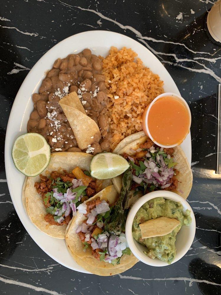 Street Tacos · Top rated street tacos topped with fresh cilantro and onions with the meat of your choice asada, adobada, pastor chorizo and chicken.