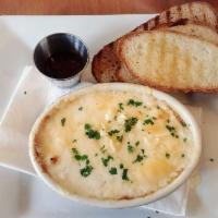 Baked Eggs · 2 baked eggs with Parmesan cream sauce, Swiss cheese and fresh herbs. Comes in it's own terr...