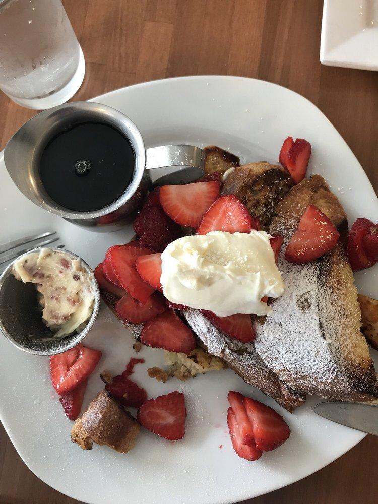 French Toast · 4 triangles of French toast topped with our Marionberry preserve and sweet cream with a side of maple syrup.