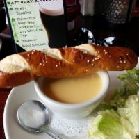 Cheddar Ale Soup · Served with pretzel twist.