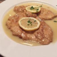 Chicken Francese · Batter-dipped sauteed in lemon, butter, and white wine. Served with a choice of tossed house...