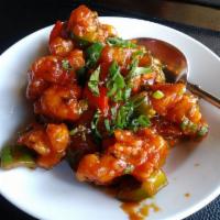 Gobi Manchurian · Crunchy cauliflower florets, red onion, bell pepper, tossed in sweet and sour spicy sauce.