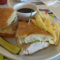 World Famous American Sandwich · Choice of roast beef, turkey breast or ham with Swiss cheese and Ortega chiles, served on gr...