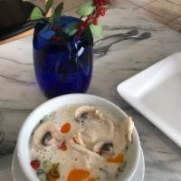 Tom Kha Soup · Thai lemongrass and coconut broth served with tomatoes, mushrooms, scallions, and cilantro. ...