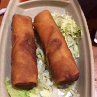 Dragon Spring Rolls · 2 pieces. Shanghai style rolled in a crispy wrapper with cabbage, carrots and glass noodles.