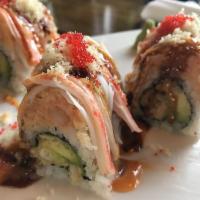 Anniversary Roll · Tempura lobster, avocado and cucumber inside topped with lobster salad and crab.