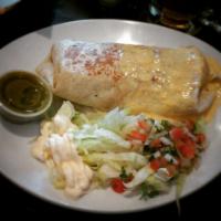 Chimichanga · Flour tortillas stuffed with chicken or beef with rice and beans topped with melted cheese o...