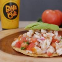 Shrimp Ceviche · A crisp, deep-fried corn tortilla piled high with shrimp ceviche marinated in lime juice and...
