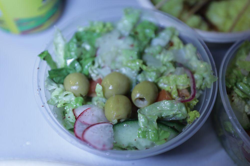 Fattoush Salad · Romaine, radish, olives, tomatoes, cucumbers, onions, sumac, lemon dressing and olive oil.