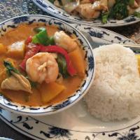Thai Pumpkin Curry · Combination of chicken, scallops, prawns, bell pepper, Thai pumpkin with red curry and fresh...