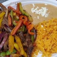 Fajitas · Served with rice, beans, guacamole, and tortillas.
