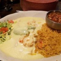 Seafood Enchiladas · Corn tortillas filled with cheese topped with shrimp, crawfish and sliced avocado covered wi...