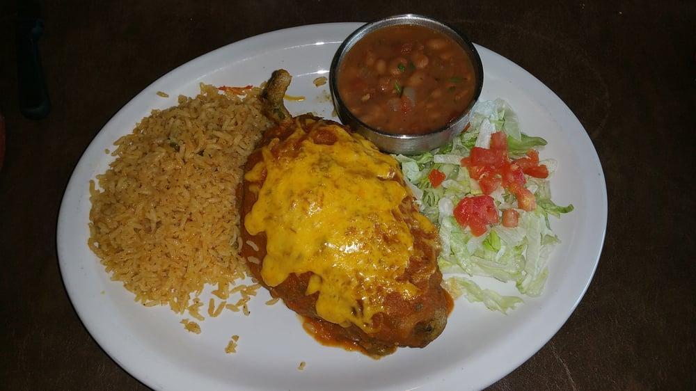 Chile Relleno · Poblano pepper stuffed with ground beef and cheese, deep-fried, topped with ranchero sauce and Cheddar cheese. Served with Spanish rice borracho beans and fresh homemade flour tortillas.