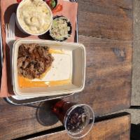Pulled Pork · Hand-pulled, slow-smoked pork shoulder glazed with our house-made BBQ Sauce. Served with an ...