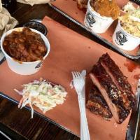 Spare Ribs · St. Louis style pork spare ribs slow-smoked for 6 hours. Served with an optional assortment ...