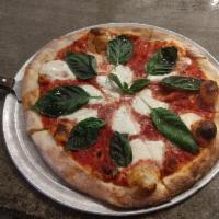 Margherita Pizza · Fresh mozzarella, fresh basil, Parmesan and extra virgin olive oil.