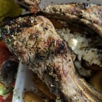3 Pieces Lamb Chops Skaras · 3 charbroiled chops served with Greek salad, steak fries, and pita bread.