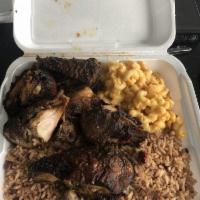 Jerk Chicken · Spicy Jerk Chicken, served with rice/beans and your choice of one side 