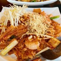 Pad Thai · Stir fried rice noodle with choice of meat, egg, bean curd and bean sprouts, topped with gro...
