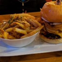 The Hangover Burger · Cheddar cheese, applewood-smoked bacon, mini classic poutine, over easy fried egg, carameliz...