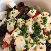 Greek Salad · Feta cheese served with lettuce, tomatoes, cucumber, onions, olives olive oils, feta cheese ...