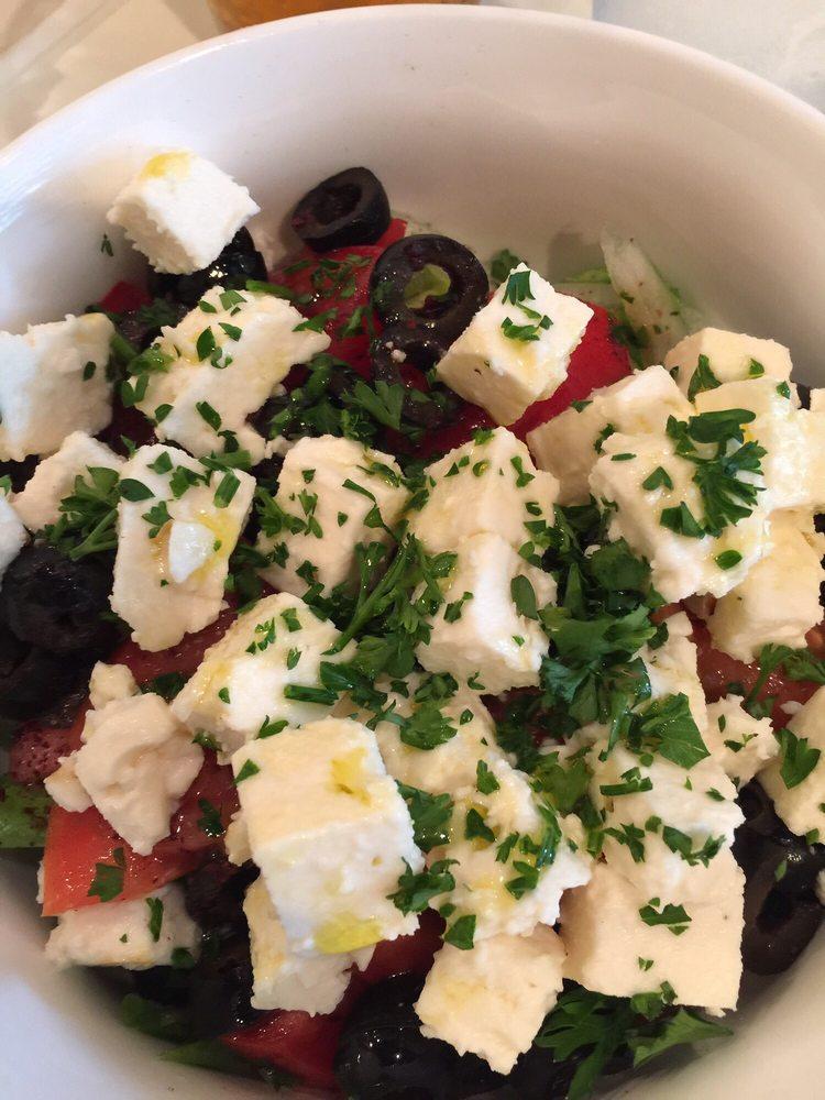 Greek Salad · Feta cheese served with lettuce, tomatoes, cucumber, onions, olives olive oils, feta cheese and spices.