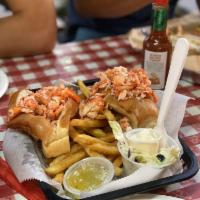 Naked Lobster Roll · Lobster meat on a roll served with sides of mayo and butter.