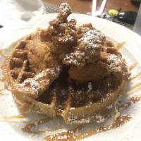 Fried Chicken and Waffle · Country fried shaved breast of chicken with caramel drizzle and powdered sugar.