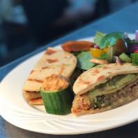 Quinoa Burger · Vegan. Seared and served on toasted naan bread with avocado, vegan cheese and seasonal salad...