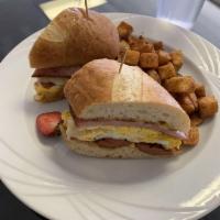 Z's Monte Christo · Spicy sausage link, ham, fried egg, jalapeno jack cheese and baguette served Cuban style. Se...
