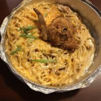 Fried Chicken Spaghetti · A Lucy's twist on moms favorite casserole topped with cheddar.