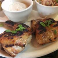 Lone Star Grilled Chicken · Brined half chicken with Lone Star cream gravy and your choice of side.