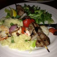 Kabob Trio · Jumbo shrimp, scallop and beef tenderloin kabobs, grilled and brushed with garlic butter and...