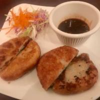 Chive Dumplings · Crispy or steamed vegetable dumpling with tangy sweet and sour chili soy sauce.