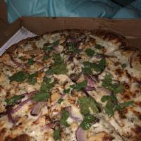 White Sauce Chicken Pizza · Ranch sauce, mozzarella cheese, chicken, red onions and cilantro.