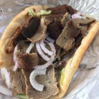 Gyro · Spicy beef and lamb or chicken, lettuce, tomatoes, red onions and tzatziki sauce, wrapped in...