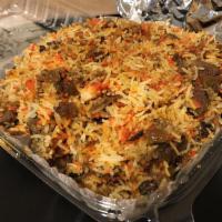 Lamb Biryani · Basmati rice with lamb and spices. Served with raita and curry sauce. Gluten-free. Nut-free.
