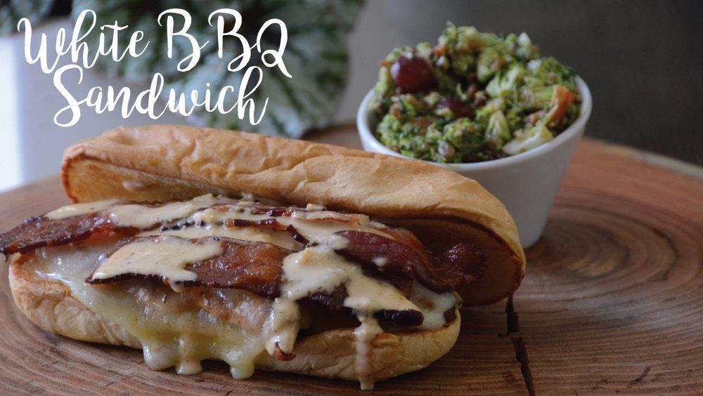 White BBQ Sandwich · Grilled chicken, house-made white BBQ sauce, pepper jack cheese, and bacon. Served on a warm French roll.