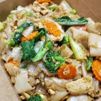 Pad See Ew · Stir-fried thick rice noodle with eggs, garlic, carrot, Chinese broccoli, broccoli and black...