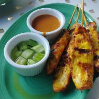 4 Piece Chicken Satay · Skewered chicken marinated and slow grilled, served with peanut sauce and cucumber relish sa...